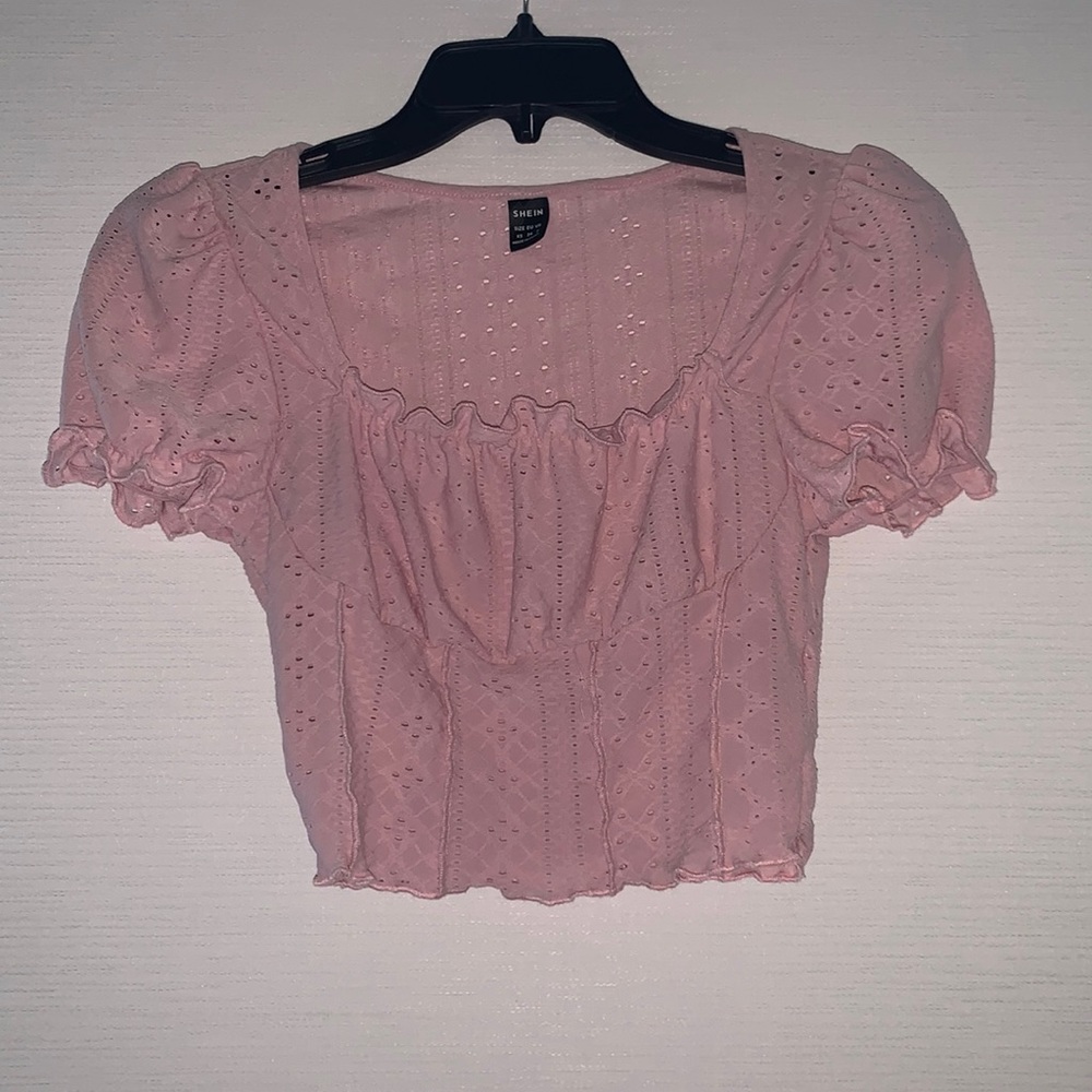 Pink top with designs
